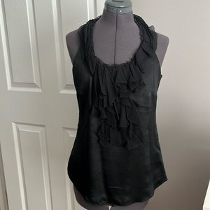 Black satin halter-style tank with ruffle detail.